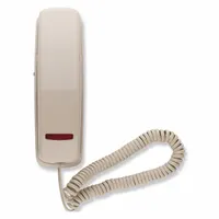 Indoor surface-mountable phone with plastic enclosure, lighted keypad, and volume control. Includes phone line cord. Suitable for healthcare facility rooms where basic voice communication is needed