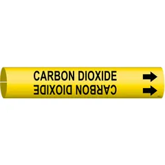 Yellow snap-on pipe marker with black legend reading 'Carbon Dioxide' and directional arrows. Fits pipe outer diameters from 3/4 to 1-3/8 inches. Supplied as a single marker. Used to identify carbon dioxide lines in industrial piping systems for hazard communication and compliance with pipe-marking standards.