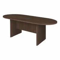Laminate/melamine oval conference table in Neo Walnut finish. Overall length 71 in, width 35 in. Slab leg design with PVC edge banding. Suitable for meeting rooms, boardrooms, and collaborative workspaces