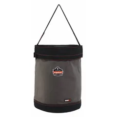 This gray canvas bucket bag measures 16 inches wide by 20 inches high by 16 inches long. It features a buckle closure and has no pockets. Designed for carrying tools, parts, and supplies in industrial and maintenance environments.