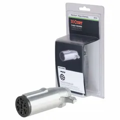 Plastic 7-way trailer plug for connecting tow vehicle electrical system to trailer lights, brakes, and turn signals. Suitable for utility trailers, boat trailers, and RVs requiring a standard 7-pin connection.