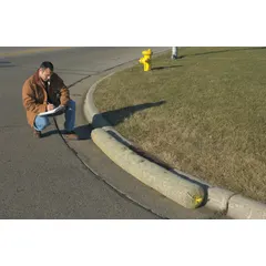 This set-in-place curb drain filter captures sediment and debris from stormwater runoff. It is designed for installation in commercial and industrial drainage systems to help prevent clogging and reduce maintenance on downstream infrastructure. The filter measures 12 ft in length, 9 in in width, and 9 in in height.