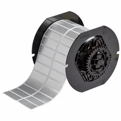Precut label roll measuring 1 1/2 in x 1/2 in, made of metalized polyester with a silver finish. Halogen-free material suitable for industrial identification and asset labeling in environments requiring low toxicity. Compatible with BBP33 printer series.