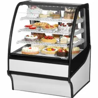 This curved glass display refrigerator merchandiser from the TDM series features a white finish and uses R-290 refrigerant. It is designed for commercial settings to showcase chilled beverages and perishable foods, with dimensions of 49 1/8 in width, 36 1/4 in depth, and 39 in height