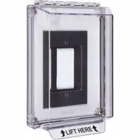 This clear polycarbonate guard is designed for outdoor wall-mounted emergency buttons. It features a LIFT HERE legend and includes mounting hardware for flush installation. Rated IP56 and NEMA 3RX, it provides waterproof protection against vandalism and accidental damage. Overall depth is 1 15/16 inches