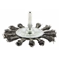 Twisted steel wire wheel brush with 0.014" fill, 3 1/4" diameter, and 3/8" width. Features a 1/4" shank for rotary tool use. Designed for heavy cleaning of contoured carbon steel surfaces, such as removing rust, scale, and weld splatter in metal fabrication and maintenance tasks