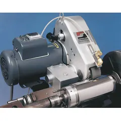 This tool post grinder uses 2 in x 36 in abrasive belts for precision grinding on lathes and other machine tools. Powered by a 240V AC single-phase motor with 2 hp, it is suitable for grinding, deburring, and finishing metal workpieces in toolroom and maintenance operations.
