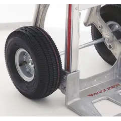 Pneumatic wheel replacement part for use with MAGLINE model HTMK17U4 material handling equipment. Provides mobility and shock absorption on uneven surfaces in industrial environments such as warehouses and factories.