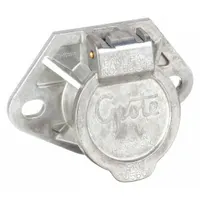 Trailer receptacle with a diameter of 3 15/16 inches. Features solid brass pins for corrosion resistance and consistent electrical conductivity. Used to connect electrical systems between a towing vehicle and trailer for lighting and signal functions