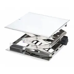 Stainless steel lab lift with a platform size of 10 in by 10 in and a height range of 3 1/2 in to 13 in. Used in laboratories and industrial settings to safely raise and position equipment or containers.