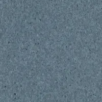 This vinyl composition tile (VCT) features a Crown Texture finish in Mid Grayed Blue. Each tile measures 12 inches in width. Suitable for commercial and industrial flooring applications requiring a durable, easy-to-maintain surface