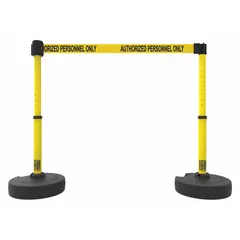 This retractable belt barrier system includes two posts and a 15 ft yellow belt printed with 'Authorized Personnel Only.' The belt retracts into the post when not in use, allowing flexible crowd control. Typical applications include defining secure zones and controlling pedestrian access in industrial facilities, warehouses, and manufacturing plants.