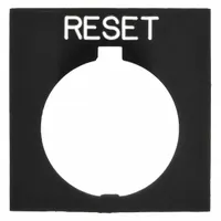 Rectangular non-metallic legend plate for 30 mm push-button operators. Black body with white 'Reset' legend in English. Overall height 1 in, width 1 1/2 in. Used to label control functions in industrial panels and machinery