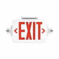 White plastic exit sign with round side-mount light heads, configurable for 1 or 2 faces. Features red/green LED illumination, pop-out chevrons, and a nickel cadmium battery. Operates on 120 to 277 V AC, remote capable, for ceiling mounting in emergency egress applications