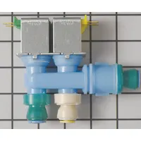 This water inlet valve controls water flow to the refrigerator's ice maker and water dispenser. It opens to supply water when the refrigerator calls for ice or chilled water, then closes to stop flow. Suitable for use in Whirlpool refrigerators and freezers