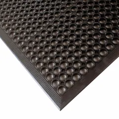 This standard drainage mat features a raised-ring design with beveled edges, constructed from black natural rubber. At 1/2 in thick and non-reversible, it provides a slip-resistant surface for industrial environments where drainage and standing comfort are required.