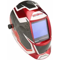 Auto-darkening welding helmet with graphic finish in black, red, and white. Features 4 arc sensors, analog controls, and a shade range of W5-13. Includes grind mode for non-welding tasks. Nylon shell with ratchet suspension adjustment. Viewing area measures 3.74 x 3.34 inches. Suitable for welding and grinding applications