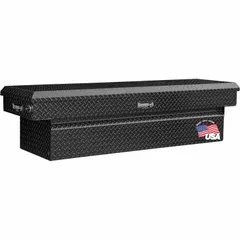 This single-lid crossover box is constructed from aluminum with a gloss black finish. It has an overall width of 71 inches. Designed for pickup trucks, it provides secure, weather-resistant storage for tools and equipment.