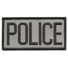 Sew-on embroidered insignia measuring 4 inches by 2 inches. Constructed of plastic in black and gray. Attaches to fabric by sewing. Suitable for uniform identification on chest or other garment areas.