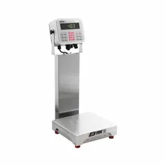 Food scale with 12 in x 12 in weighing surface, 26 in overall height, and LCD display. Readability of 0.005 kg/5 g/0.01 lb/0.16 oz. IP69K rated for washdown environments. RS-232 connection port for data output. Suitable for industrial weighing applications requiring high-pressure sanitation.