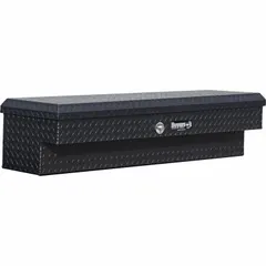 Side-mount truck box constructed of aluminum with a matte black finish. Overall height of 13 inches and overall width of 56 inches. Equipped with a push-button latch for quick access. Suitable for storing tools and equipment on work trucks, service vehicles, and fleet applications.