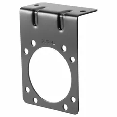 Mounting bracket for securing automotive electrical plugs in trailer wiring connections. Overall length 2 3/4 inches, height 3 3/4 inches. Used in fleet and vehicle maintenance for stable mounting of trailer connectors.