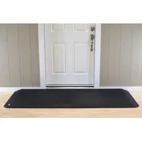 This black rubber ramp is 82 inches long and ADA compliant. It provides a threshold solution for accessibility, allowing wheelchairs, carts, and walkers to cross doorways smoothly. Suitable for commercial and industrial facilities needing a durable, slip-resistant ramp