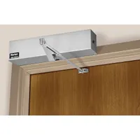 The NORTON 6300 Series Low Energy Door Operator (MPN 6351R x BSP) is a heavy-duty, non-hold-open closer for limited-traffic interior/exterior applications. It features a Black Suede Powder Coated finish, measures 37 3/8 in Lg x 4 3/4 in Wd x 2 3/4 in Ht, and is Performance Grade 1. This ADA-compliant unit is suitable for commercial or institutional doors requiring controlled, safe closing without automatic hold-open