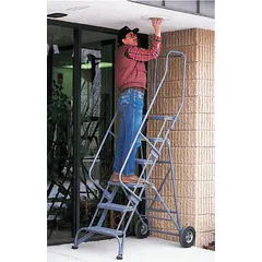 This steel folding ladder from BALLYMORE provides a 5 ft platform height with a 16 in x 14 in platform. It features double handrails for support and is finished in gray. The unit is unassembled and does not include a locking mechanism. Suitable for elevated access in warehouses, stockrooms, and industrial settings.
