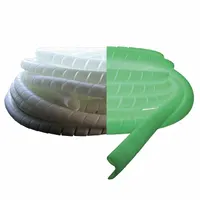 This spiral hose wrap is made from off-white polyethylene and features a luminescent property that glows in the dark. It is used for bundling and protecting hoses and cables in low-light industrial environments. The wrap measures 66 feet in length and 1 5/8 inches in width