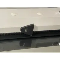 Rubber gravity sash stop for fume hoods. Prevents sash from closing fully to maintain airflow. Includes mounting hardware. Overall dimensions: 1 3/4 in width and length. Compatible with model GRF-350-48G7-2