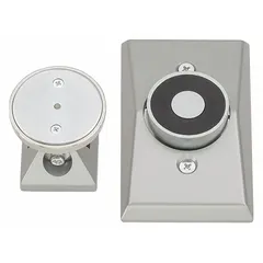 Wall-mounted electromagnetic door holder constructed of aluminum. In normal conditions, it holds fire-rated doors open. Upon power loss or fire alarm activation, the Fail Safe mode releases the door to close automatically, supporting life safety and compartmentation in commercial buildings.