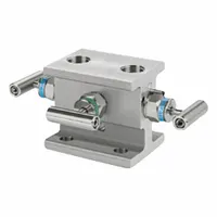 This 3-valve manifold features flange inlet and flange outlet connections, rated for 6000 psi. Constructed with PTFE components, it is used in industrial fluid systems for isolating, redirecting, or combining flow