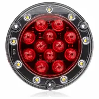 Red round LED combination light providing stop, turn, and tail functions. Features a PL-3 female connector and permanent flange mounting. Complies with SAE J2261 standards. Overall depth 7/16 in. Suitable for use on trailers, trucks, and heavy equipment as a rear lighting solution