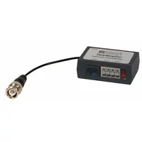 Plastic video/balun/combiner for integrating video and 12VDC power transmission in surveillance systems. Non-isolated design for use as a camera accessory with compatible power supplies
