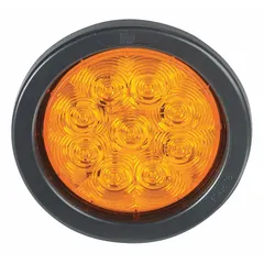 Red LED turn signal light with round shape, 4 in overall diameter and 1 3/4 in overall depth. Features grommet mount, permanent installation, and wire harness connection. Complies with SAE J593 standards. Used on trucks, trailers, and industrial vehicles to indicate turning direction.