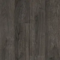 This luxury vinyl tile features an embossed Glen Brook Oak finish in Evening Shadow color. Each square tile measures 6 inches wide. Suitable for commercial and residential flooring applications in high-traffic areas