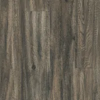 This Armstrong Flooring Parallel USA LVT tile from the Cornelius Creek collection features an embossed square design in Sage Brown. Each tile measures 6 inches in width. Suitable for commercial and residential flooring applications, it provides a natural stone look for spaces such as retail, hospitality, and offices