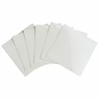 Clear polyester laminate sheet with permanent adhesive, measuring 2 1/2 in by 2 1/2 in. Applied over printed labels to protect against abrasion, chemicals, and moisture in industrial environments