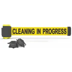 This magnetic-mount retractable belt barrier features a 7 ft yellow belt with black housing and base. It is used for temporary pedestrian guidance or crowd control in industrial and commercial facilities, particularly for maintenance, cleaning, or messaging zones where flexible lane management is needed.