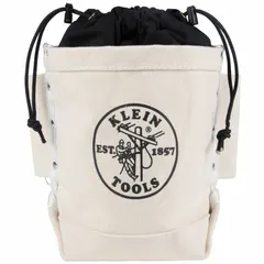 This off-white canvas bucket bag features a drawstring closure and two pockets for organizing tools and fasteners. Side loops accommodate standard bull-pins for hands-free carrying. Suitable for job site tool storage and transport.