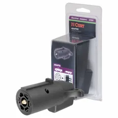 This adapter connects a 7-way blade vehicle socket to a 5-way flat trailer plug, enabling towing of trailers with flat-4 or flat-5 wiring. Made of plastic with an overall length of 3 7/8 inches. Commonly used for utility trailers, boat trailers, and small RVs in fleet and vehicle maintenance applications.