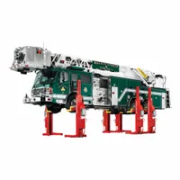 This forked mobile column lift is an electric/hydraulic vehicle lift system with a 9 ton load capacity. It features a steel frame and wireless lifting actuator for mobile operation. Typical applications include lifting heavy vehicles in automotive repair and industrial maintenance facilities