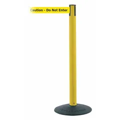 This retractable belt post barrier features a yellow plastic post and a black cast iron base. The yellow belt extends up to 13 ft and is printed with 'Caution Do Not Enter' text. It is used for pedestrian traffic control and queue management in industrial facilities, warehouses, and public spaces.