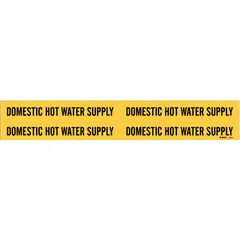 Yellow adhesive pipe marker with black legend reading 'Domestic Hot Water Supply'. Fits pipe outer diameters from 3/4 to 2-3/8 inches. Supplied without arrows. Used to identify hot water supply lines in facility piping systems.