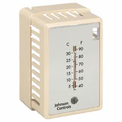 Beige plastic cover for Johnson Controls T-4000 series pneumatic thermostats. Includes built-in thermometer, setpoint window, and logo. Designed for vertical mounting. Protects the thermostat while allowing temperature reading and adjustment in commercial HVAC systems.