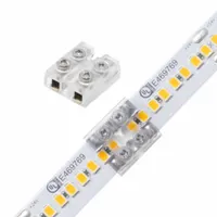 This tape-to-tape connector joins two tape light segments using a terminal block, accepting wire gauges from 20 AWG to 16 AWG. It is used in linear lighting installations for secure low-voltage connections