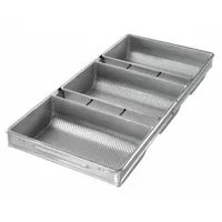 This 3-slot pan set is constructed from aluminized steel for even heat distribution and durability. Designed for baking rye bread or miche loaves, the pan has a silver finish and an overall width of 12 1/4 inches. Suitable for commercial or high-volume bakery use