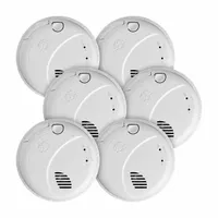 This hardwired combination smoke and carbon monoxide detector operates on 120V AC with AA battery backup. It uses a photoelectric sensor for smoke detection and an electrochemical sensor for CO, sounding an 85 dB alarm. Includes two AA batteries and a test button. Complies with NFPA 72 standards