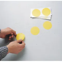 Solid yellow circle-shaped floor marking tape made of 4 mil thick vinyl. No legend printed on the tape. Each piece measures 5 in x 5 in. Supplied in a pack of 500. Used for marking safety zones, equipment locations, or hazard areas on floors.